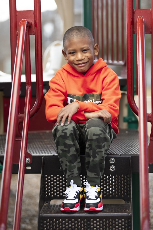 young children's portrait in park