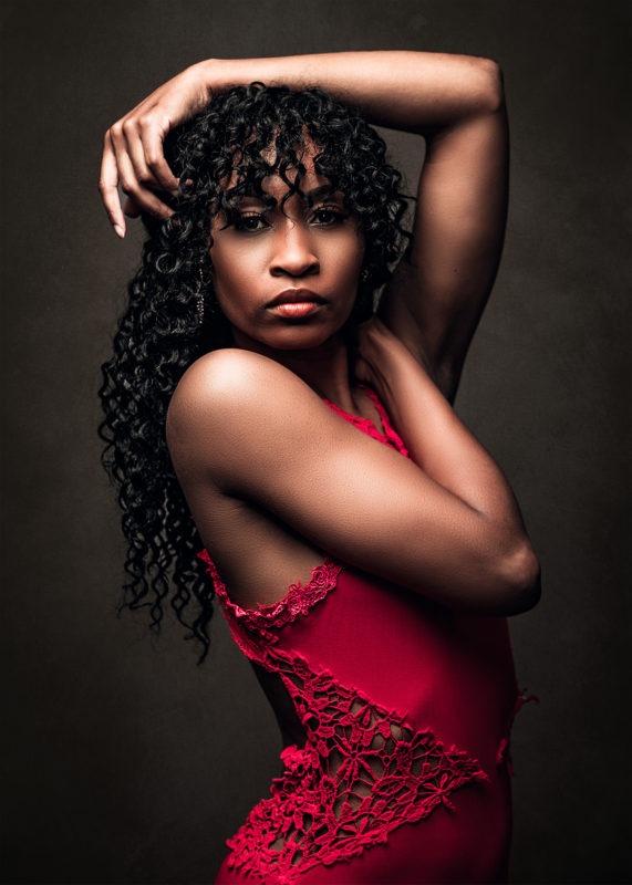 Black woman model in red dress