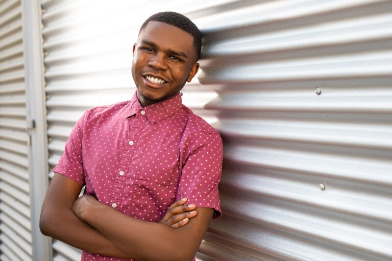 High shcool senior on metal door