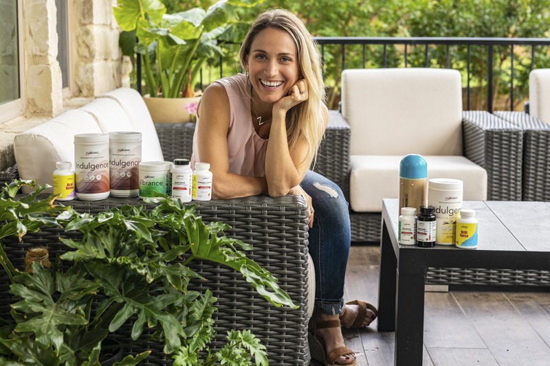woman on patio selling supplements