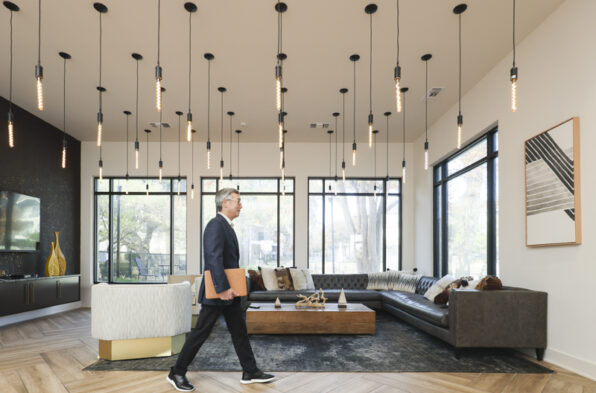 hair stylist in salon with coffee mug