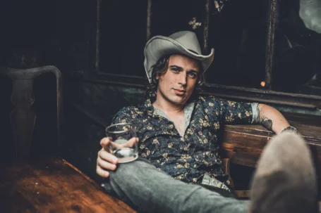 Austin brand photo session cowboy enjoying a drink ,