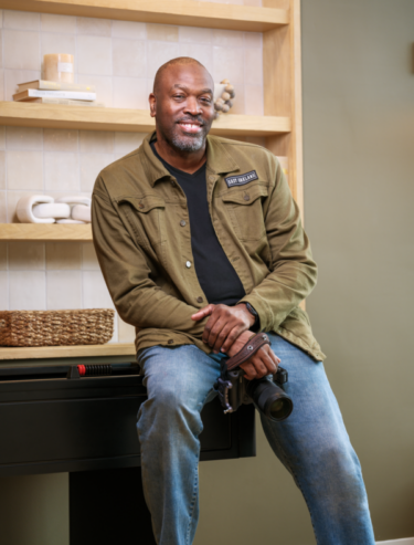 Eric Colean Of Eric Coleman Photography. in green jacket photo by Erica Payne