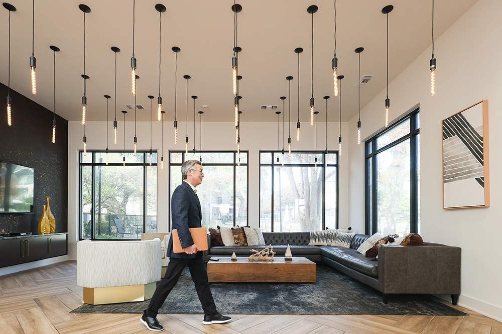 Austin CEO Businessman walking through lobby 