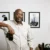 Eric Coleman, Austin brand photographer, holding a camera in his studio